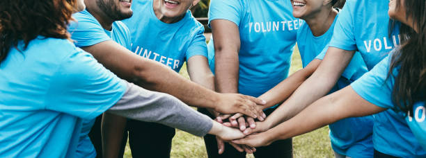 Volunteers joining hands